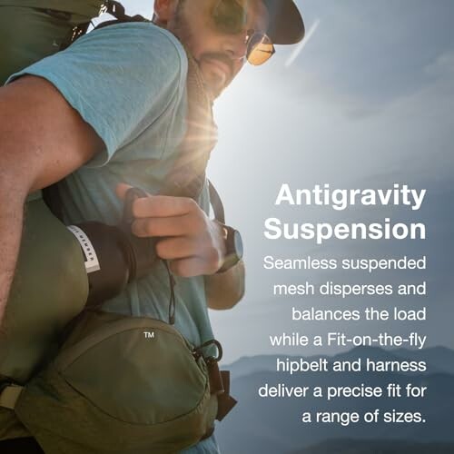 Man hiking with antigravity suspension backpack in sunlight.