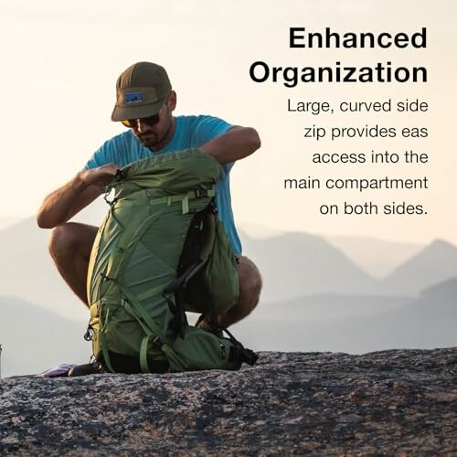 Man organizing backpack on mountain with text about enhanced organization.