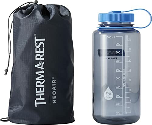 Therm-a-Rest NeoAir sleeping pad in a bag next to a blue-capped water bottle